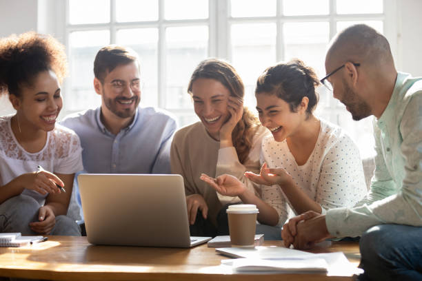 istock Multi-ethnic friends laughing enjoy comedy movie on computer 1263705762