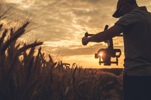 istock Video Camera Operator with Gimbal Stabilization Taking Scenic Sunset Shot 1263707099