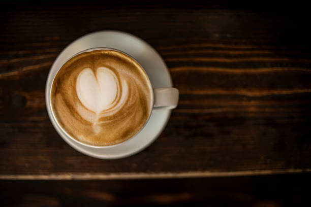 istock Espresso coffee cup with coffee bean on a wooden retro surface 1263707181