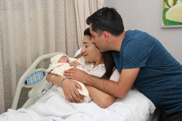 istock Newborn in hospital with parents 1263707889