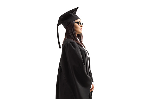 Female graduate student in a black gown isolated on white background