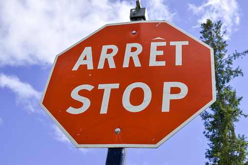 Stop sign in English and French. Quebec