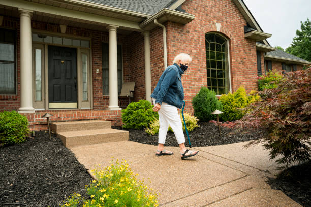 istock Senior leaving home wearing face mask 1263712551