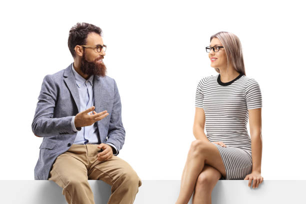 istock Man talking to a blond woman seated on a panel 1263713259