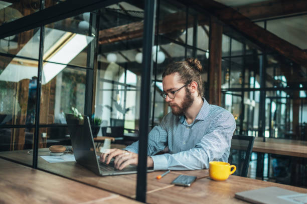 istock Young businessman working at office 1263713320