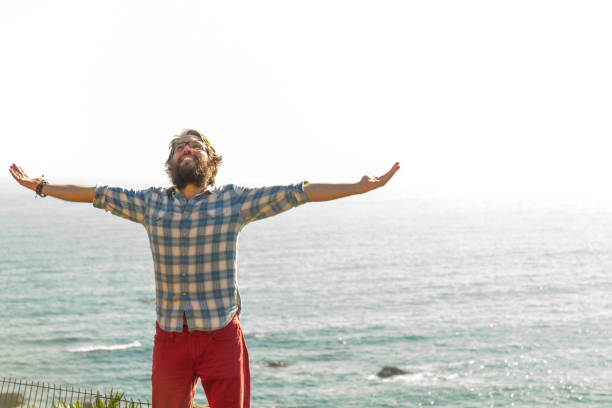 istock Young man feel freedom at the beach 1263714283