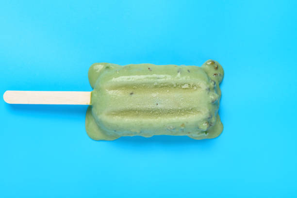 istock top view mung bean popsicle starts melting on a blue background 1263717260
