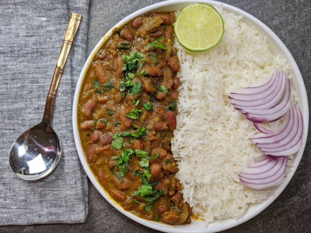 A platter of Indian red Kidney beans curry or Rajma Masala and rice A platter of Indian red Kidney beans curry or Rajma Masala and rice with copy space. masala stock pictures, royalty-free photos & images