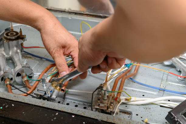 istock man fixing a gas cooker 1263719429