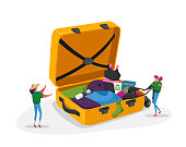 istock Tiny Girls Take Out Traveling Clothes or Accessories from Huge Suitcase after Vacation Trip, Summer Time Leisure Journey 1263724084