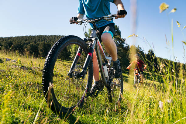 istock front view of two men doing sport with their bike 1263724431