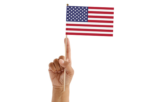 American Flag held in hand on white background