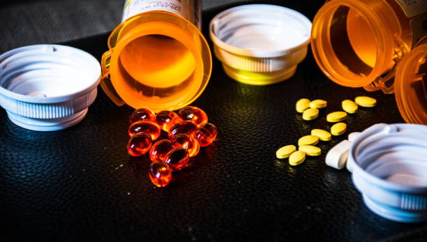 istock open Pill Bottles and capsules ready to take medicine 1263731122