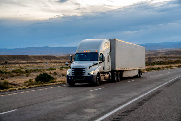 istock White Semi-Trailer Tractor Truck Driving Down a Four-Lane Highway 1263740097