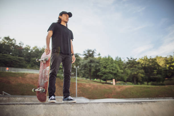 istock Asian man playing skateboard at skatepark 1263740217