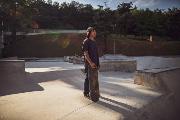 istock Asian man playing skateboard at skatepark 1263740227