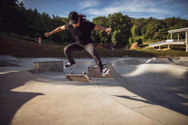 istock Asian man playing skateboard at skatepark 1263740230