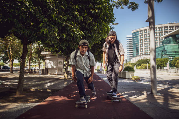 istock Asian man playing skateboard at town 1263740238