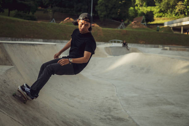 istock Asian man playing skateboard at skatepark 1263740249