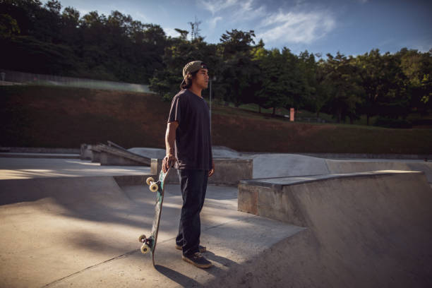 istock Asian man playing skateboard at skatepark 1263741836