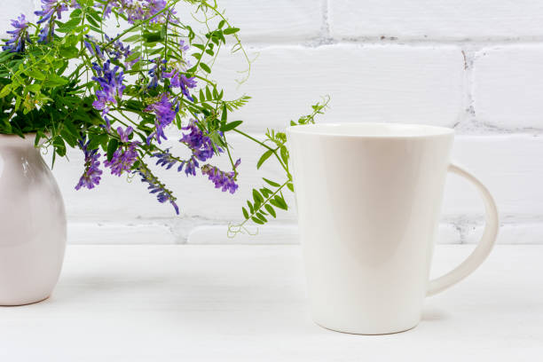 istock White coffee latte mug mockup with purple bird vetch 1263749302