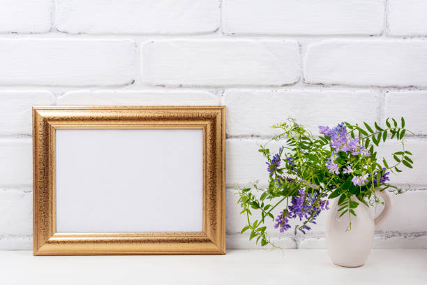 istock Gold decorated landscape frame mockup with bird vetch 1263749303