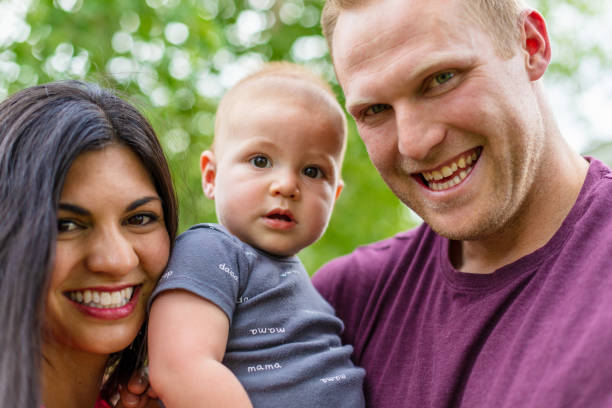 istock Young Married Millennial Multi-Ethnic Couple Outdoors with Toddler Child 1263754226