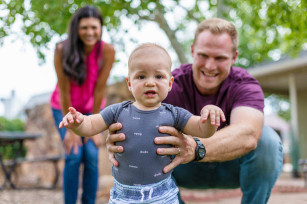 istock Young Married Millennial Multi-Ethnic Couple Outdoors with Toddler Child 1263754237