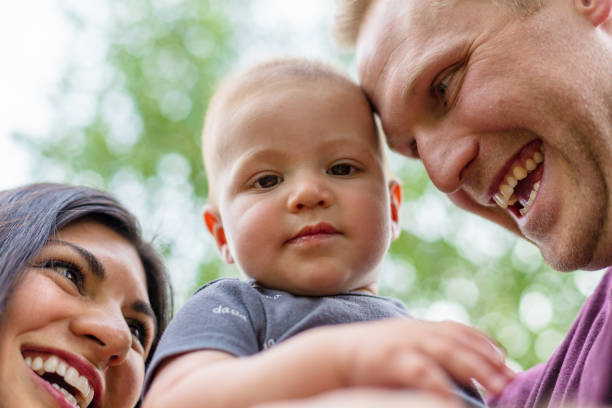 istock Young Married Millennial Multi-Ethnic Couple Outdoors with Toddler Child 1263754243