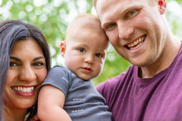 istock Young Married Millennial Multi-Ethnic Couple Outdoors with Toddler Child 1263754276
