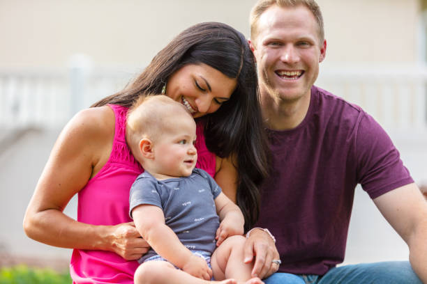 istock Young Married Millennial Multi-Ethnic Couple Outdoors with Toddler Child 1263754921