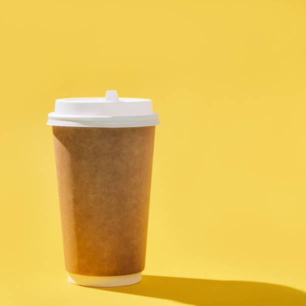 istock Blank craft take away big paper cup for coffee, dark shadow. 1263755090
