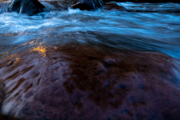 istock Stream of flowing river in the evening light 1263756883