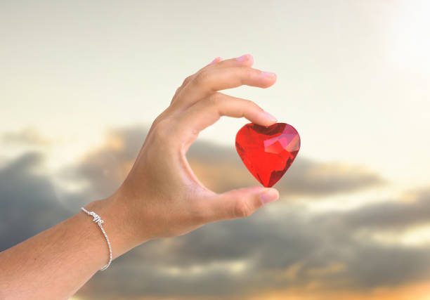 istock woman hand holds red heart 1263761571