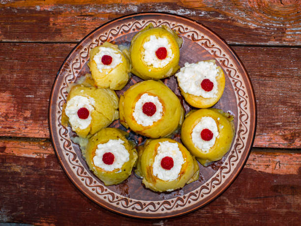 istock Baked apples stuffed with cottage cheese and raspberries. 1263762310