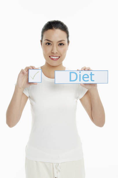 istock Woman holding up small placards 1263762643