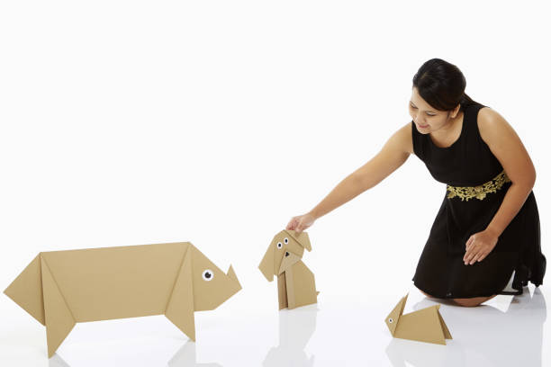 istock Woman petting a paper dog 1263763441
