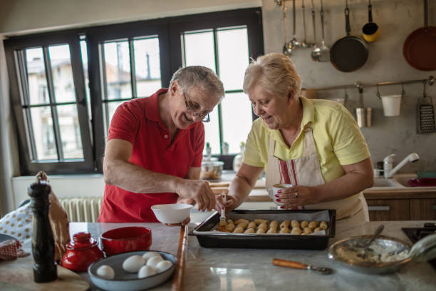 istock Happy senior couple baking in the kitchen 1263765755