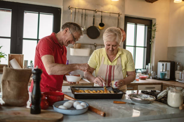 istock Happy senior couple in the kitchen 1263765956