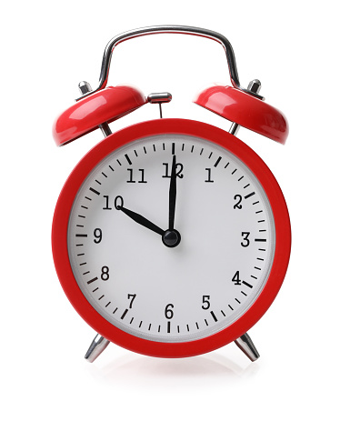 Red alarm clock isolated on white background with clipping path