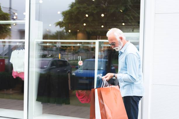 istock Senior man carrying shopping bags 1263770560