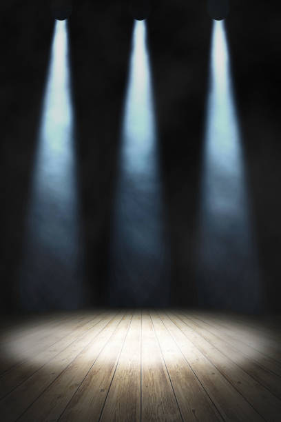istock Empty stand up scene with wooden floor and spot lights.. Empty room studio gradient used for background and display your product. 3d illustration 1263771503