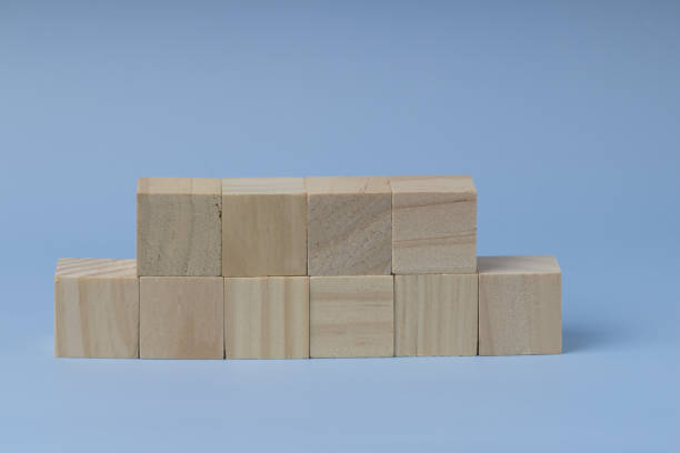 istock wooden blank blocks in a row on the blue background. Copy space 1263771690