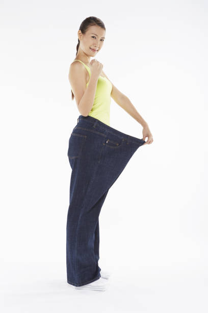 istock Woman in over sized jeans 1263772771