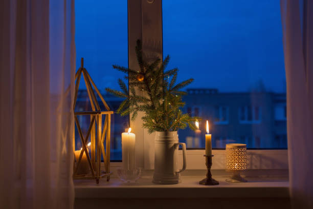istock Christmas evening windowsill with burning candles 1263773790