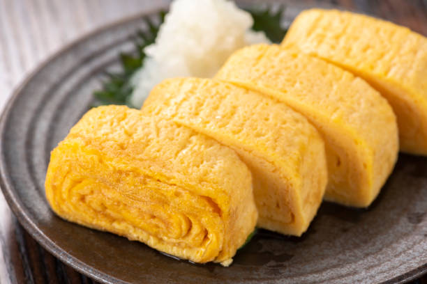 Japanese rolled omelette. Tavern cuisine.