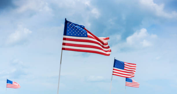 istock Four american flags against cloudscapes 1263777891