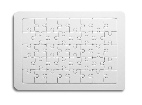 White jigsaw puzzle as mock up copy space on blue background.