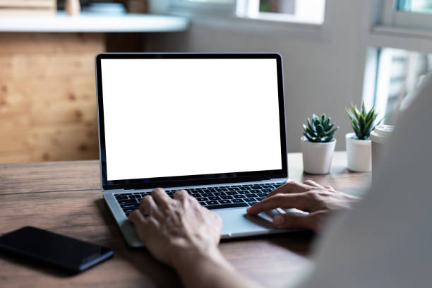 istock mock up businessman working empty screen computer on wood desk in home 1263781262