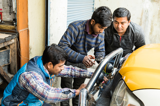 Gangtok, India, March 8 2017: Repair of the headlights on a car in Gangtok